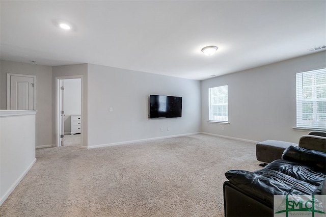 living room featuring light colored carpet