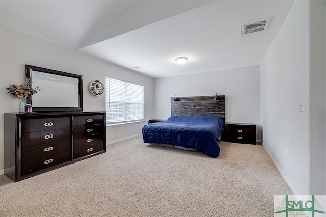 carpeted bedroom featuring vaulted ceiling