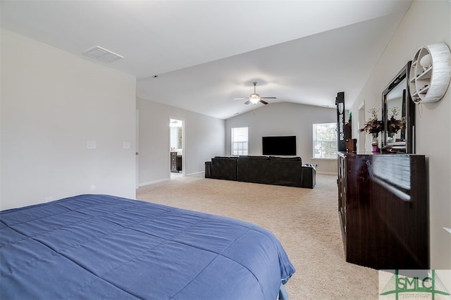 carpeted bedroom featuring ceiling fan and vaulted ceiling