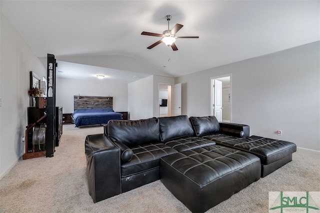 living room with carpet, lofted ceiling, and ceiling fan