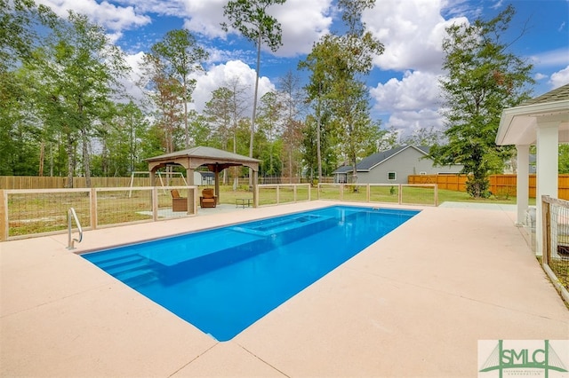 view of pool with a patio and a gazebo