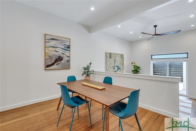 dining space featuring beamed ceiling, light hardwood / wood-style floors, and ceiling fan