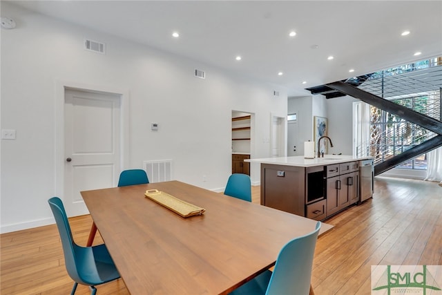 dining room featuring light hardwood / wood-style floors and sink