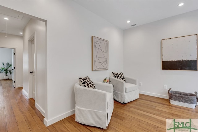 living area with light hardwood / wood-style floors