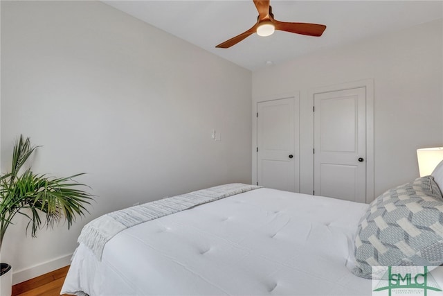 bedroom featuring hardwood / wood-style floors and ceiling fan