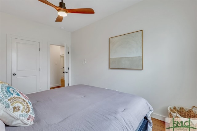 bedroom featuring wood-type flooring and ceiling fan