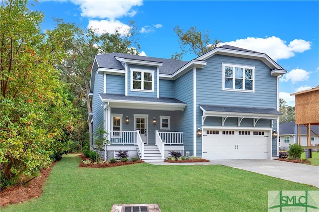 view of front of property featuring a front yard, a garage, and covered porch