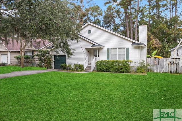 view of front of house featuring a garage and a front lawn