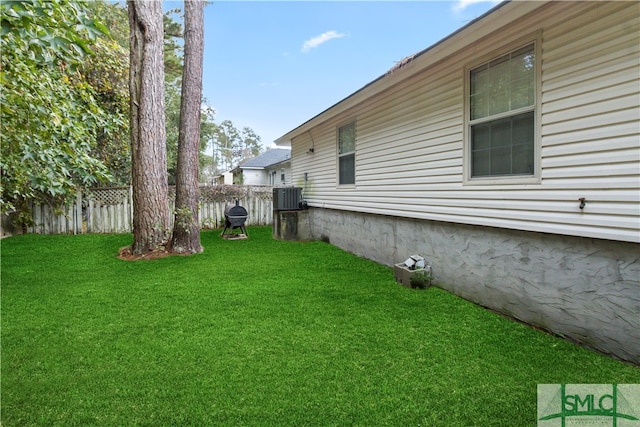 view of yard with central AC unit