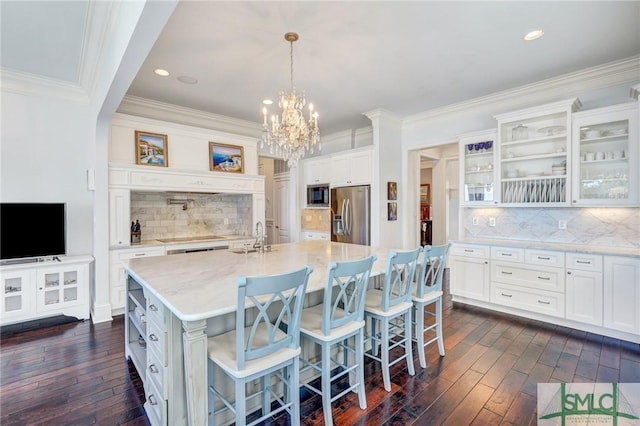1558 Wilmington Island Rd, Savannah, GA 31410 - kitchen with stainless steel refrigerator with ice dispenser, dark wood-style floors, built in microwave, glass insert cabinets, and ornamental molding