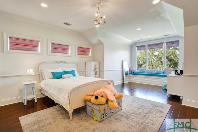 bedroom with lofted ceiling, crown molding, dark hardwood / wood-style flooring, and a notable chandelier