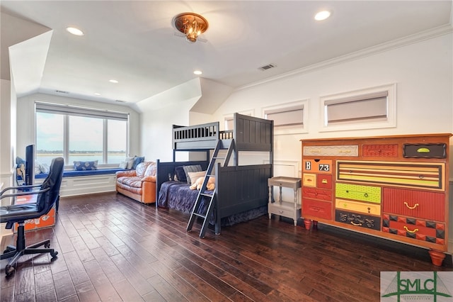 bedroom with dark hardwood / wood-style flooring and crown molding