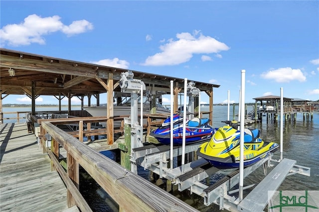 dock area with a water view