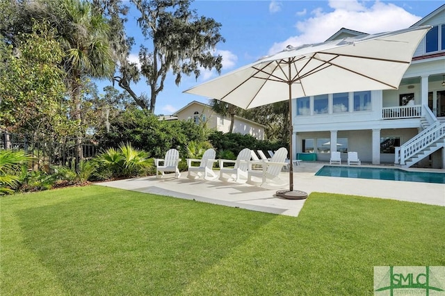 1558 Wilmington Island Rd, Savannah, GA 31410 - view of grassy yard featuring stairway, a patio area, and an outdoor pool