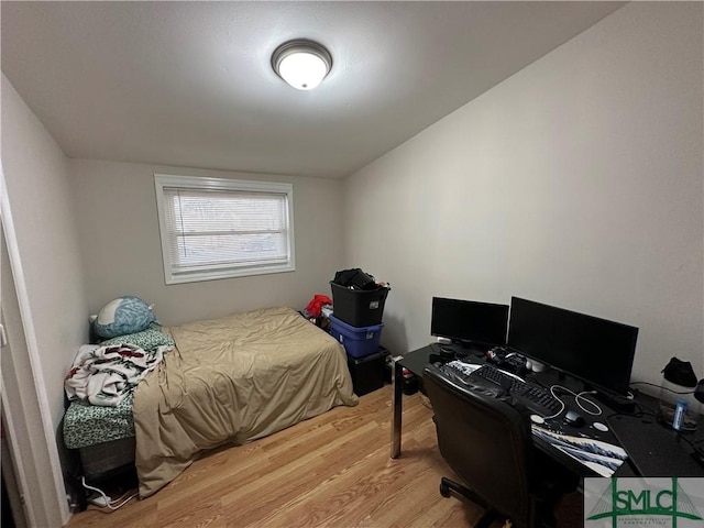 bedroom featuring wood-type flooring