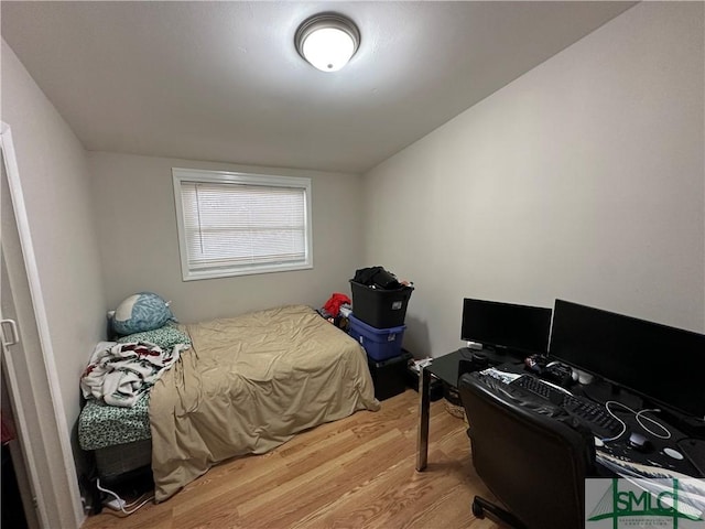 bedroom featuring wood-type flooring