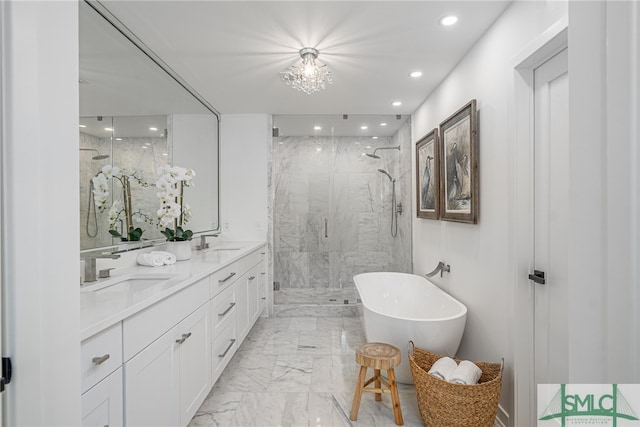 bathroom featuring a chandelier, vanity, and plus walk in shower