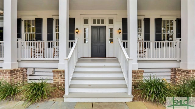 doorway to property featuring a porch