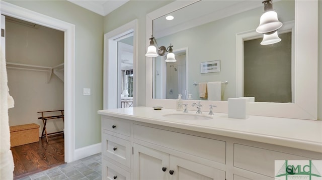 bathroom with hardwood / wood-style floors and vanity