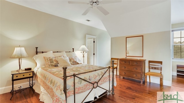 bedroom featuring lofted ceiling, ceiling fan, and dark hardwood / wood-style flooring