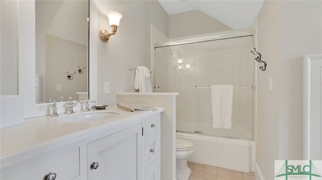 full bathroom featuring shower / bath combination with glass door, vanity, and toilet