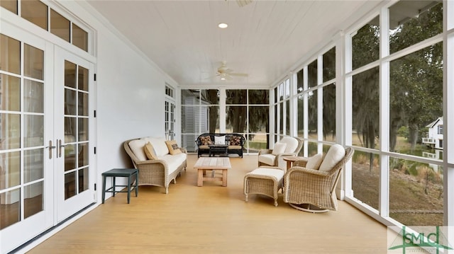 sunroom with ceiling fan, a healthy amount of sunlight, and french doors