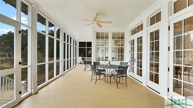 sunroom featuring ceiling fan and french doors