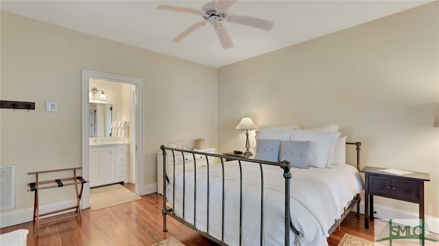 bedroom featuring ceiling fan, connected bathroom, and wood-type flooring