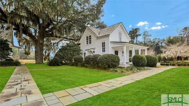 view of side of property with a yard