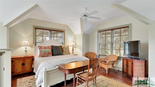 bedroom featuring dark hardwood / wood-style flooring, ceiling fan, and vaulted ceiling