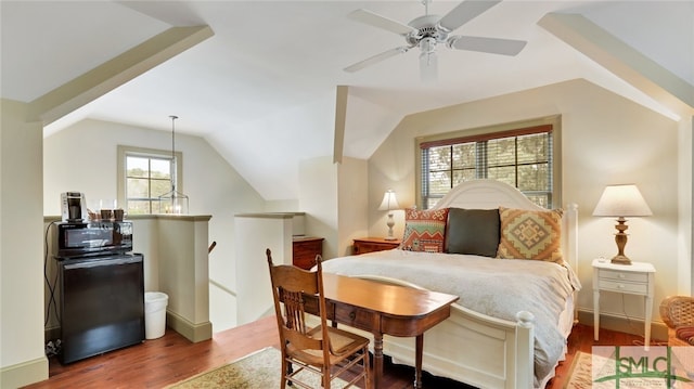 bedroom featuring hardwood / wood-style floors, ceiling fan, and vaulted ceiling