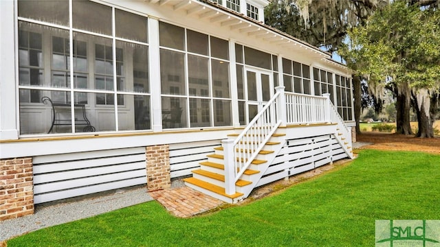 view of property exterior with a sunroom