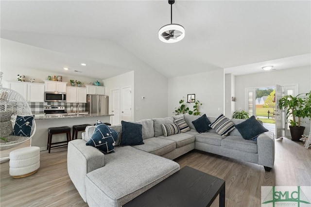 10 Henslow Fld, Savannah, GA 31419 - living area with lofted ceiling and light wood-style floors