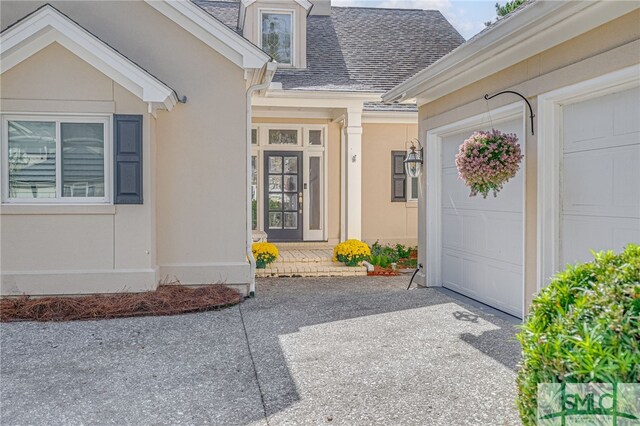 entrance to property featuring a garage