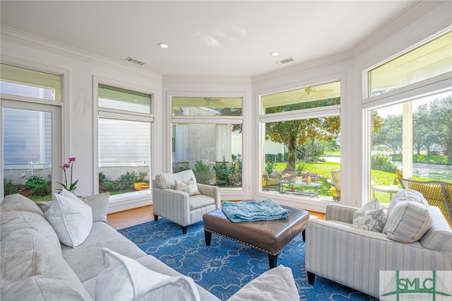 sunroom / solarium featuring visible vents and a wealth of natural light