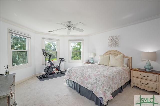 bedroom with visible vents, crown molding, and multiple windows