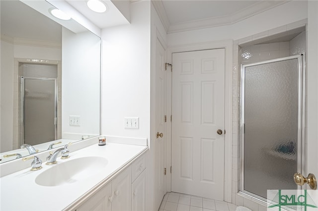 bathroom featuring ornamental molding, a stall shower, vanity, and tile patterned floors