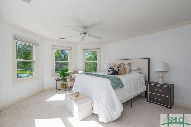 carpeted bedroom with ornamental molding, multiple windows, baseboards, and a ceiling fan
