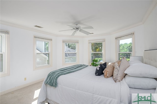 bedroom featuring crown molding, carpet floors, ceiling fan, and baseboards