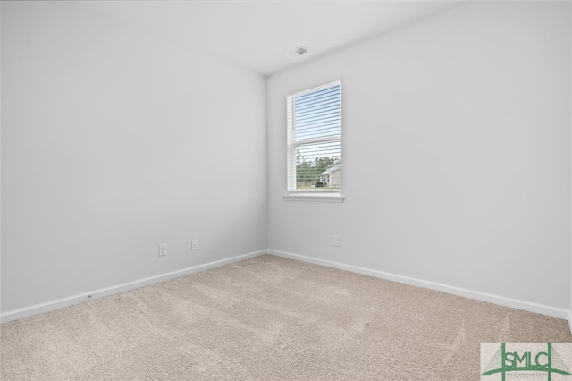 unfurnished room featuring carpet