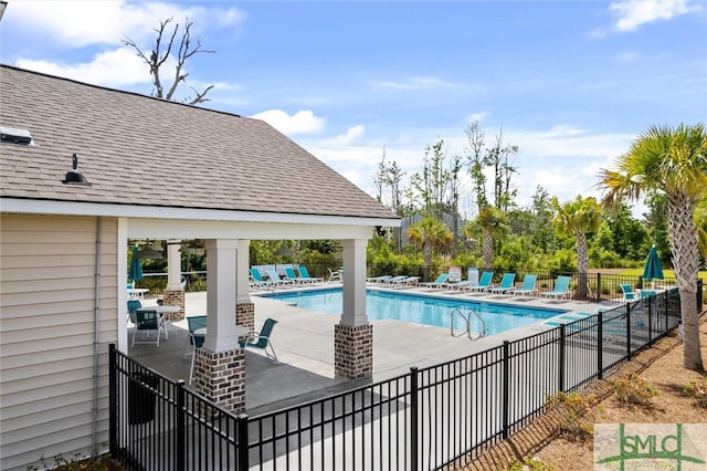 view of swimming pool featuring a patio area