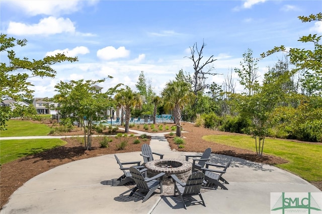 view of patio / terrace featuring a fire pit