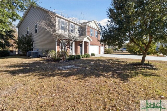 view of front of house featuring a front yard and a garage