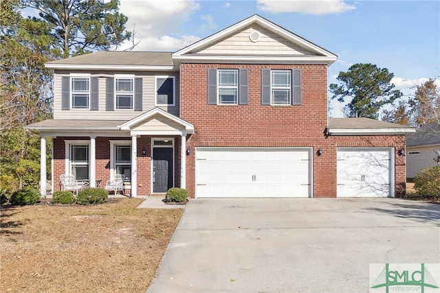 view of front facade featuring a porch and a garage