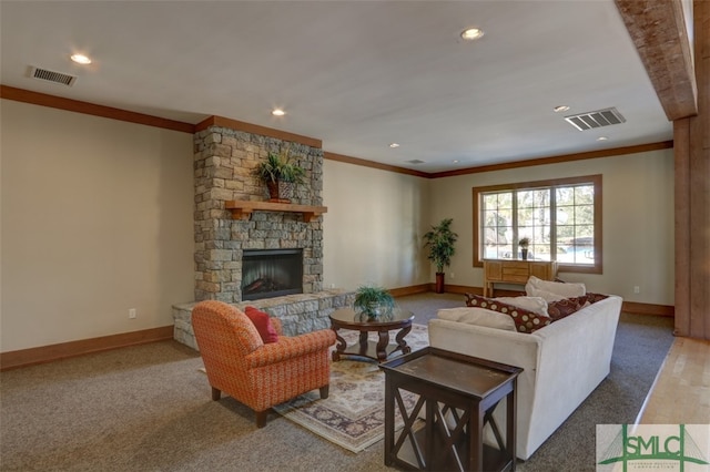 living room with carpet flooring, ornamental molding, and a fireplace