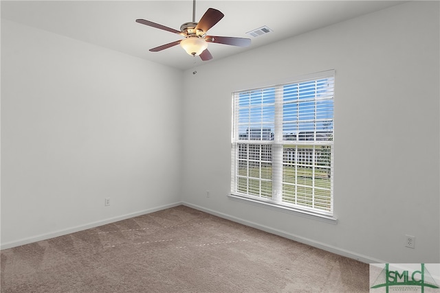 carpeted empty room with ceiling fan