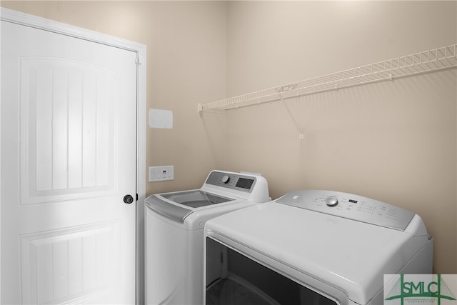 washroom with washer and clothes dryer