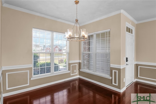 unfurnished dining area with a notable chandelier, dark hardwood / wood-style floors, and crown molding