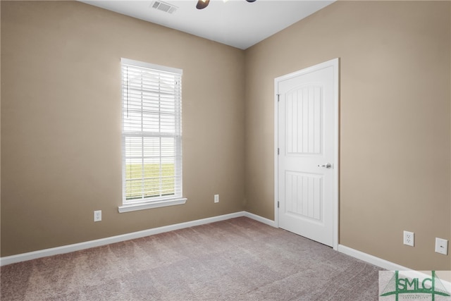 empty room with light colored carpet