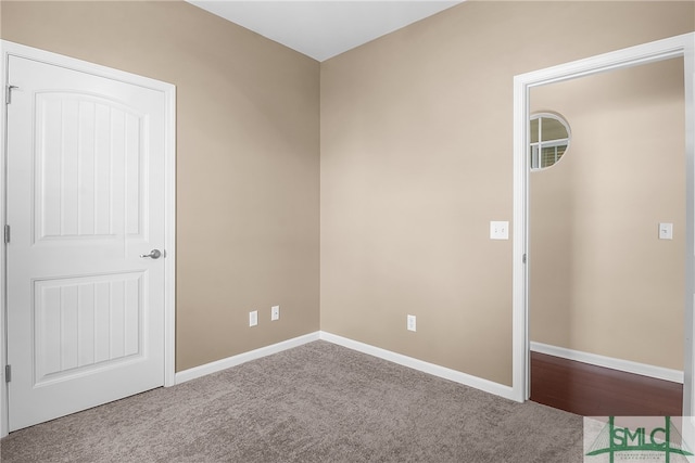 unfurnished room with light carpet